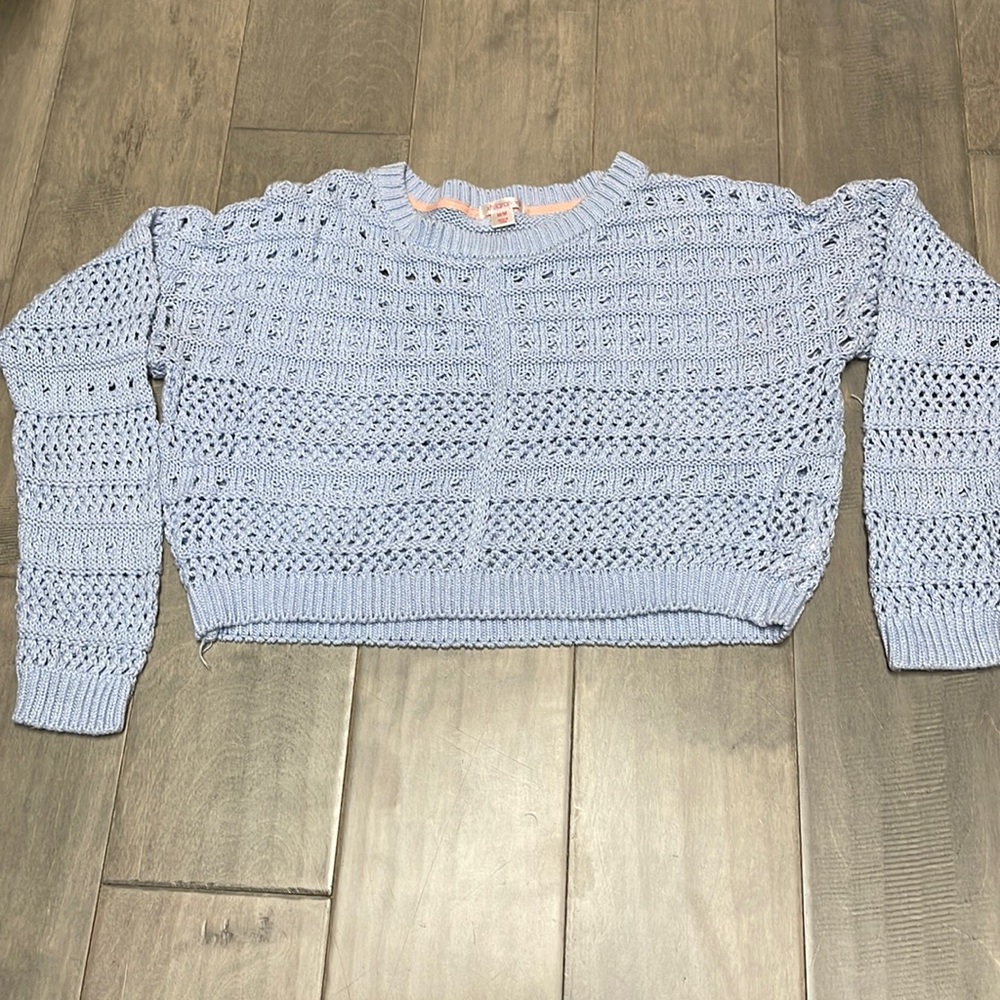 Light blue sweater/over shirt, size medium for juniors.